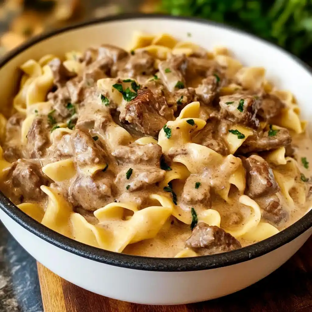 Plate of beef stroganoff with mushrooms and noodles